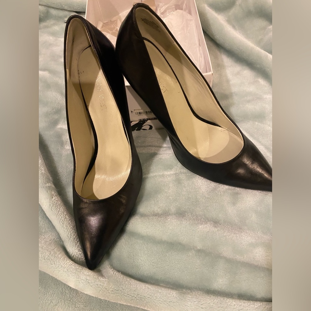Gently worn black high heel shoe.